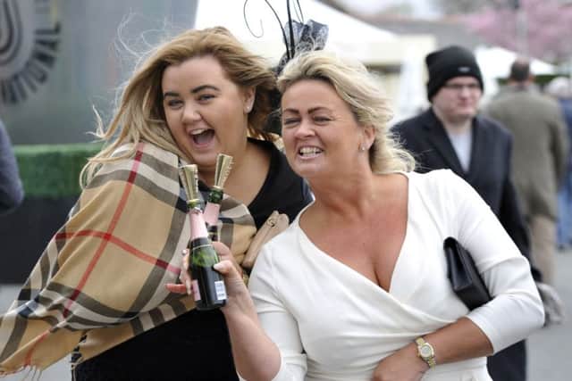 The Grand National at Aintree, Merseyside, officially opened its doors today April 7 2016. Racegoers arrived in their fancy outfits in the adverse weather conditions of high wind and shower. Many of the revelers participated in heavy drinking even in the rain and heavy winds.
