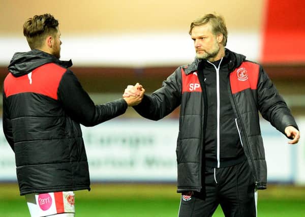 Fleetwood Town's Wes Burns is congratrulated by his  manager Steven Pressley   Photographer Richard Martin-Roberts/CameraSport
