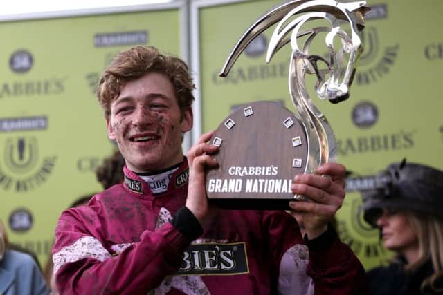 Winning jockey David Mullins with the trophy at Aintree