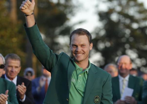 Masters champion Danny Willett gives a thumbs up in Augusta