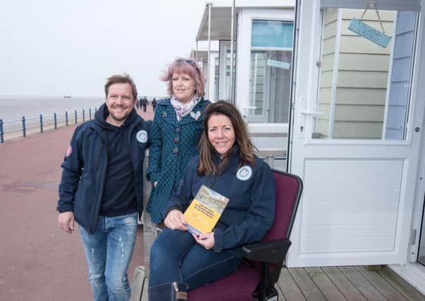Zoe Robertson of St Annes Beach Huts tries out a new prototype seat for the Lowther Pavilion, watched by husband Stuart and  Linda Hampson from the Lowther