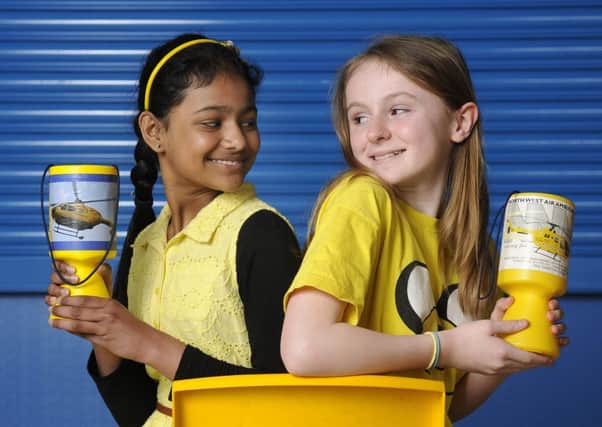 Afreen Rahman, nine, and Luisa Licursi, 10, were among the children from Mayfield Primary School who helped raise money for the North West Air Ambulance by dressing in yellow