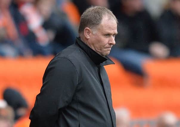 A dejected looking Blackpool manager Neil McDonald