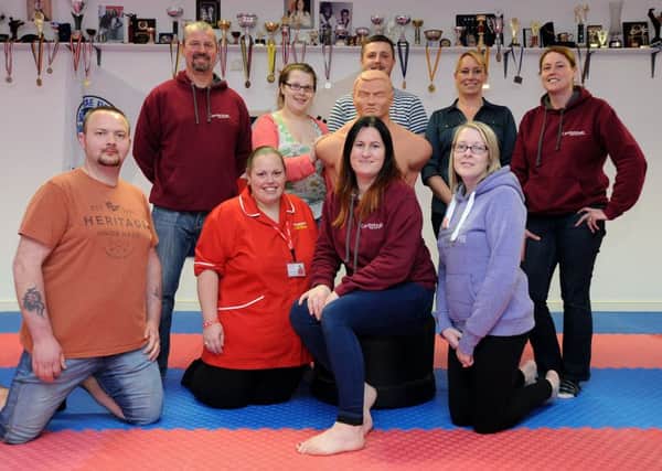 Sarah Smith from Fleetwood Taekwando Club has organised a fundraising diet with some of the members., with all proceeds going to Brian House.
Sarah (second right front) with some of the super slimmers, who have lost 23 stone between them.  PIC BY ROB LOCK
13-4-2016