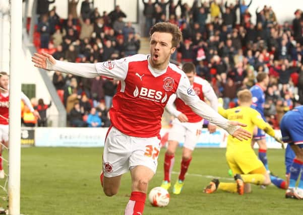 Fleetwood's Stefan Scougall celebrates after scoring against Oldham