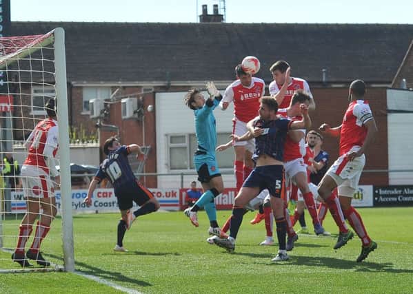 Fleetwood Town's Chris Maxwell defend his goal