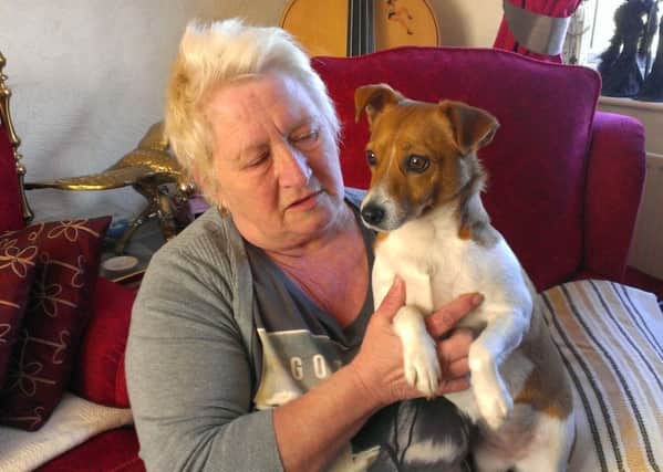 Kathleen Howard and Jess the Jack Russell, who was rescued from her smoke-filled Lostock Gardens home