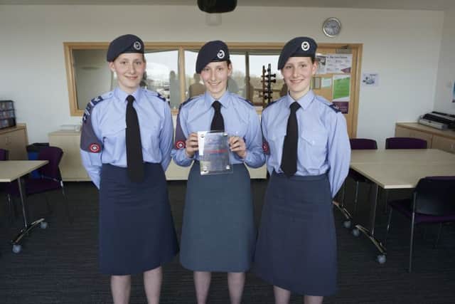 Triplets Georgia, Charlotte and Sabrina Leahy receive the platinum link award on behalf of Blackpool Sixth Form College