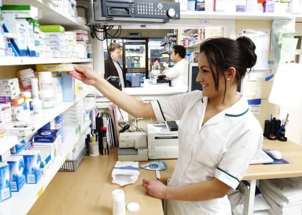 A pharmacist finds the medication for a patient's prescription (Stock image).