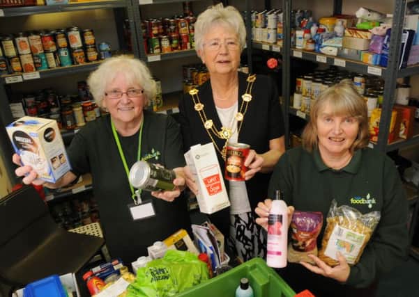 Fylde mayoress Sheila Hardy, centre, is shown round the Fylde Foodbank Kirkham depot with  trustee and co-ordinator Linda Nulty, right, and volunteer Marilyn Clayton during the official opening of the extebded Fylde CAB