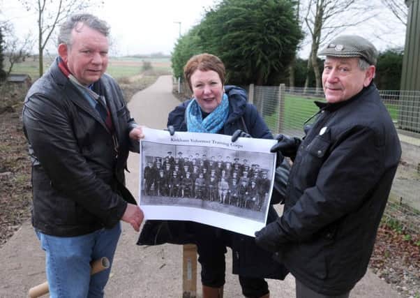 Kirkham councillors (from left) James Cameron, Liz Oades and Keith Beckett on the Remembrance Way path with a picture of the Kirkham Volunteers