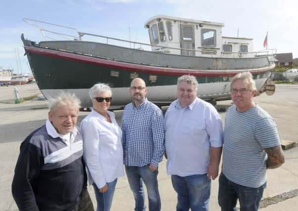Vintage lifeboat Ann Letitia Russell is back home to be restored at Fleetwood docks.  L-R are Jeff Jackson, Tish Palmer, Mark Palmer, Frank Pook and Barry Jackson.