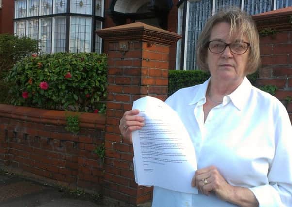 Barbara Mackenzie, president of the Holiday Association of Lytham St Annes with the letter sent out to members