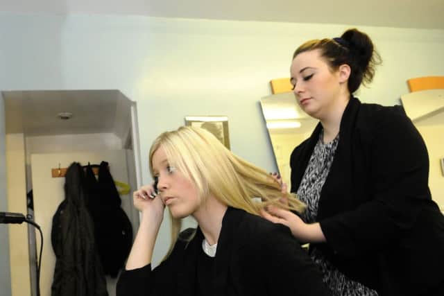 Rebecca Jayne Turner styles the hair of Miss High Street finalist Stacey Bradley