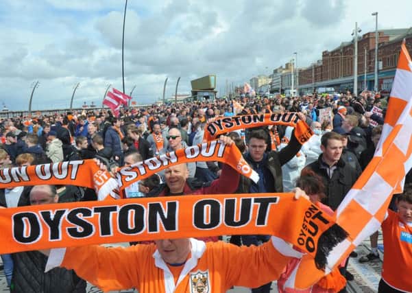 Blackpool fans protest against the Oystons on a parade through the town to the ground