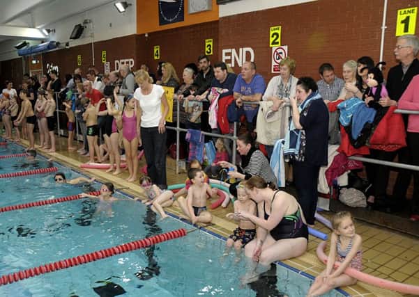 Parents and supporters cheer on the teams at the LSA Lions swimarathon