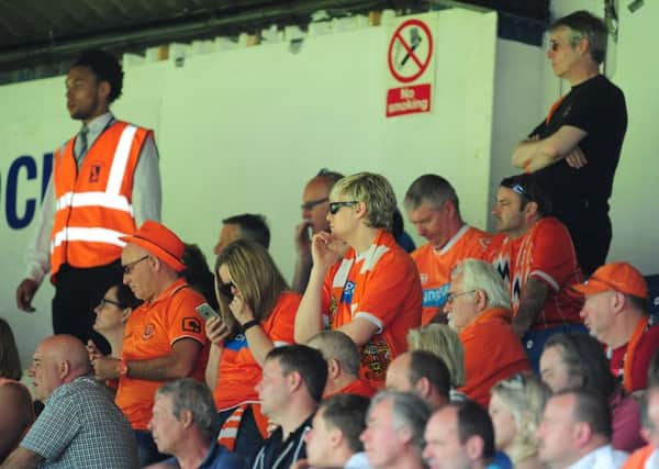 Blackpool fans look dejected during the second half as time ticks away on their sides battle to avoid relegation