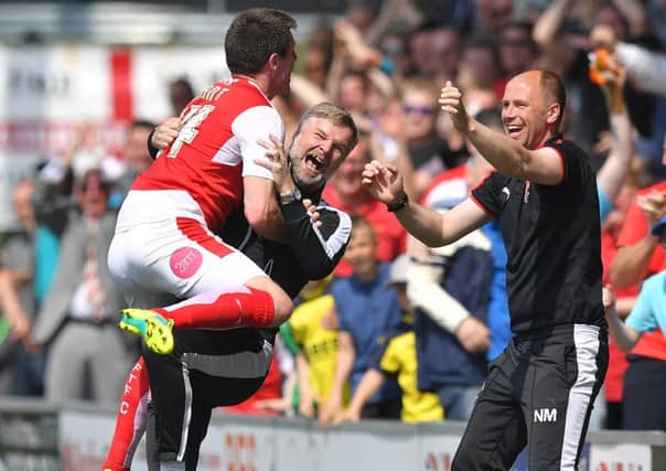 Fleetwood Town's Bobby Grant celebrates scoring his team's opening goal with Manager Steven Pressley
