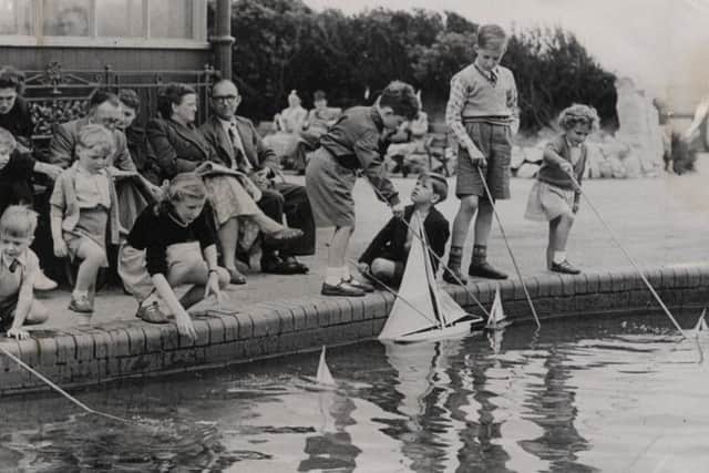 Children and holiday-makers at St Annes Model Boating and Paddling Lake