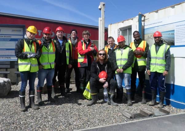 Construction students and staff from the School of Engineering at the University of Central Lancashire at the Rossall sea defences site compound, West Way, Fleetwood.