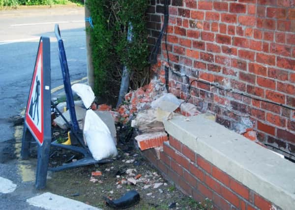 House's garden wall damaged by car accident on Chain Lane, Staining