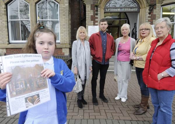 Eight-year-old Cara Restrick holds the petition against the closure of Lytham Library with fellow supporters Anne McGettigan, Adam Freeland, Kate Patten, Liz Reddy and Maureen Wilson