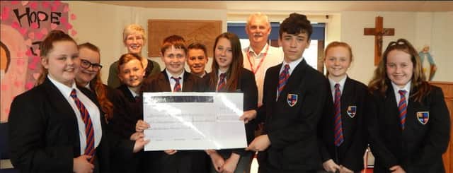 Pupils from Cardinal Allen School raised more than Â£2,000 in four and a half weeks for two foodbanks.