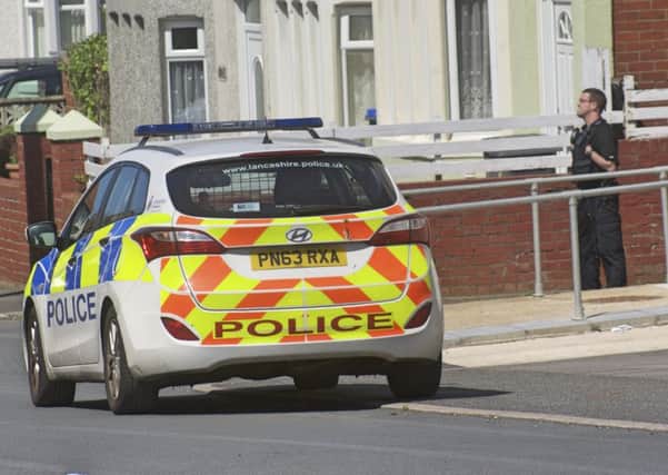 Police closed off Brixham Place in Blackpool after a man threatened to jump from flats