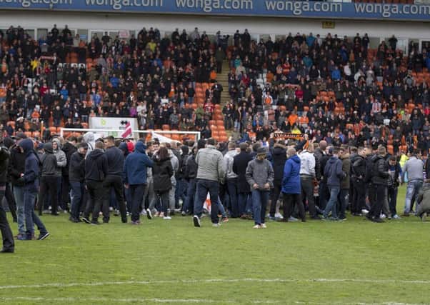 Blackpool fans stage a protest and pitch invasion last May