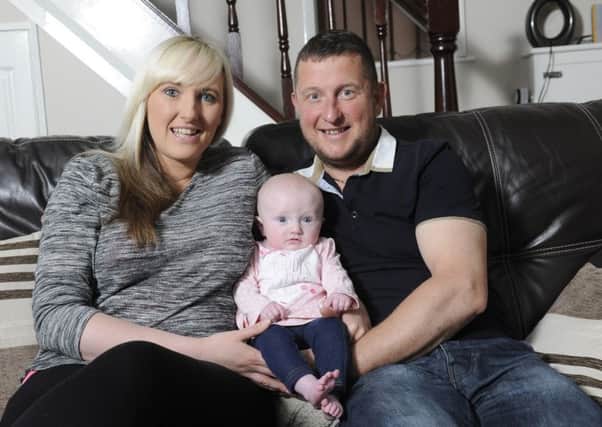 Glenn Salmon and partner Lindsey Drinnan at home with daughter Lucy-Mae Salmon in Bispham