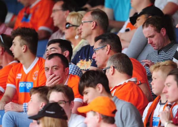 Blackpool fans look dejected during the second half at Peterborough