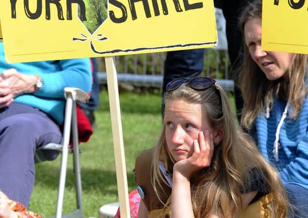 EDITORS NOTE ALTERNATE CROP

Young protestors demonstrating against fracking wait outside County Hall, Northallerton, as the council meets to decide if fracking at sites in North Yorkshire should be allowed. PRESS ASSOCIATION Photo. Picture date: Monday May 23, 2016. Photo credit should read: John Giles/PA Wire