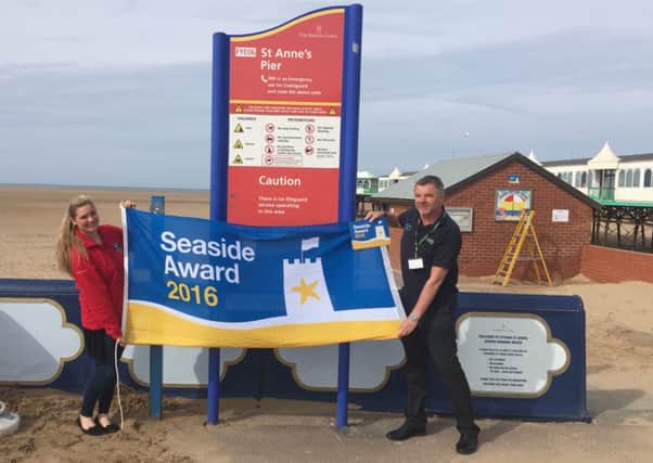 Amy Bradshaw  of Lancashire Wildlife Trust and Geoff Willetts, Fylde Council's senior coast and countryside officer, celebrate a Seside Award from Keep Britain Tidy