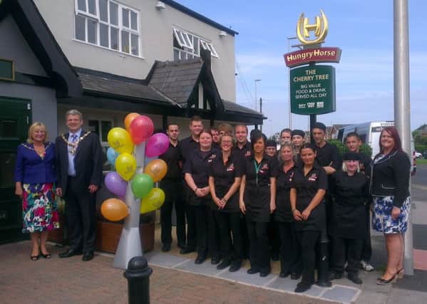 Mayor Coun Eddie Collett and the Mayoress Heather Collett join the new team at the re-opening of the Cherry Tree in Marton