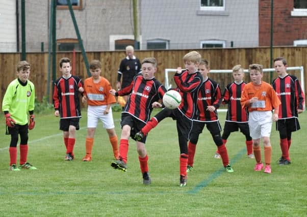 Under-11 final action between Poulton and AFC Blackpool