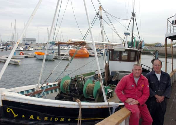 Gary Mitchinson (right) and David Wright on trawler Albion at Fleetwood Docks.