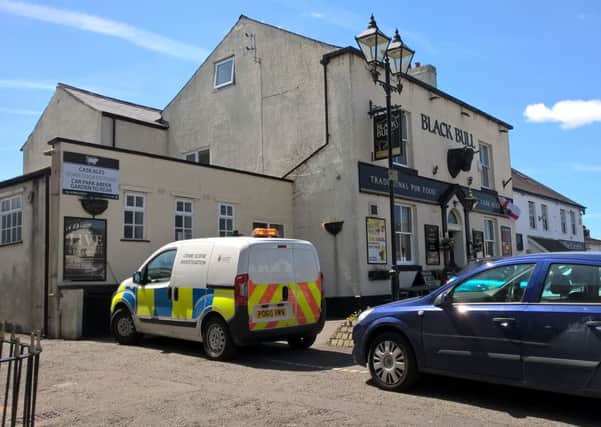 Police outside the Black Bull in Great Eccleston yesterday