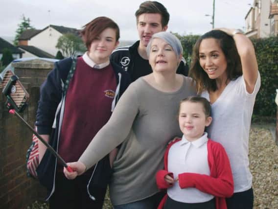 Myleene Klass (far right) joins older single mum Rhiannon Hewitt with her children, Erin, Rhys and Tegan, for a selfie at their home in Buckley, North Wales