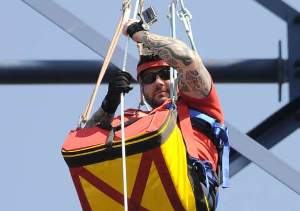 Sgt Rick Clement abseils down the Big One