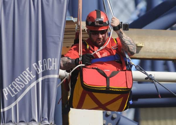 Sgt Rick Clement abseils down the Big One
