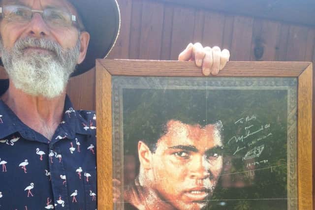 John Bentham of St Annes with a poster signed for his father by Muhammad Ali