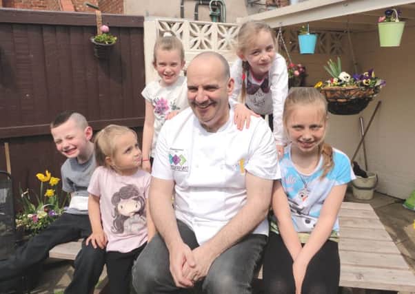The 'Pie Piper' - Ice Cold Chef John Joyce with youngsters from the Parent Carers Cookery SOS demo