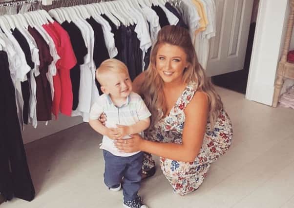 Jasmine Norton, with son Noah, one-and-a-half, at the launch of her new children's clothing range, Noah's Arc, at her shop Jasmine's Boutique in Fleetwood