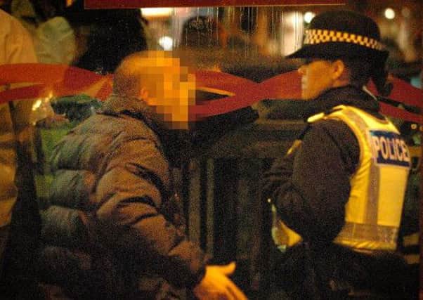 Police deal with an irate reveller in Blackpool town centre