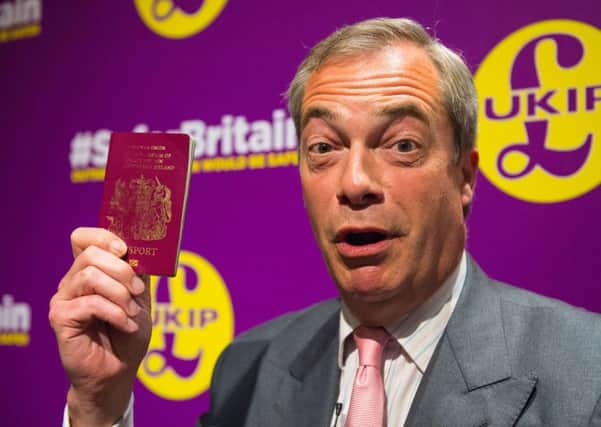 Ukip leader Nigel Farage holds his passport up after giving a speech on immigration at a Vote Leave European Referendum campaign event in Westminster. Photo: Dominic Lipinski/PA Wire