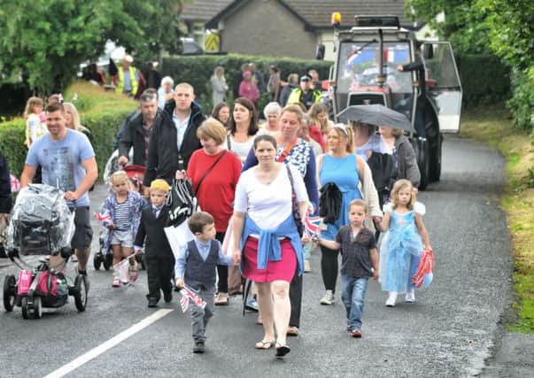 The Procession braves heavy rain

Bilsborrow Children's Festival Procession and Village Fun Day. Picture by Julian Brown