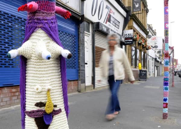 Susanne Johnson from Mrs Johnson's Emporium has been told to take down her wool decorations on Bond Street