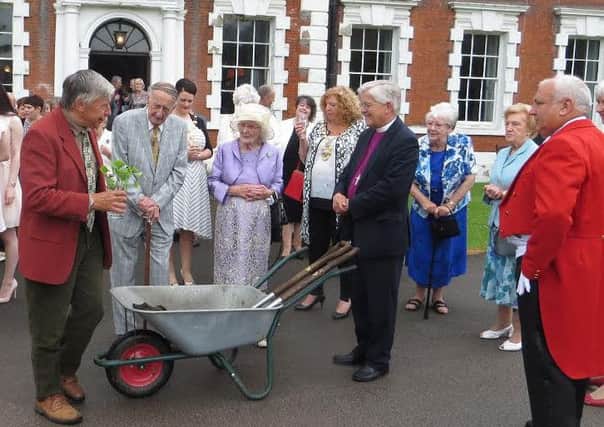 John Hornyak, grounds volunteer at Lytham Hall, presents Squire of Lytham James Hilton and his wife Penelope with a maidenhair tree planted in commemoration of the couple's diamond wedding anniversary and blessed by the Bishop of Blackburn, Rt Rev Julian Henderson
