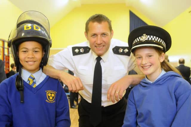 Pupils Joel Sargeant and Lily Safar with chief superintendent Stuart Noble.
