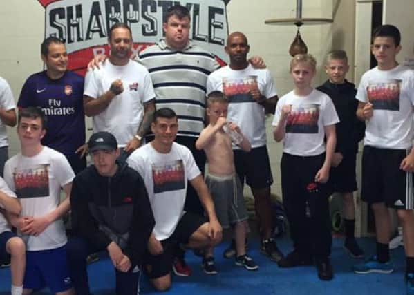 Sharpstyles Big Ryan with Trevor Sinclair and other members of the successful boxing and fitness club